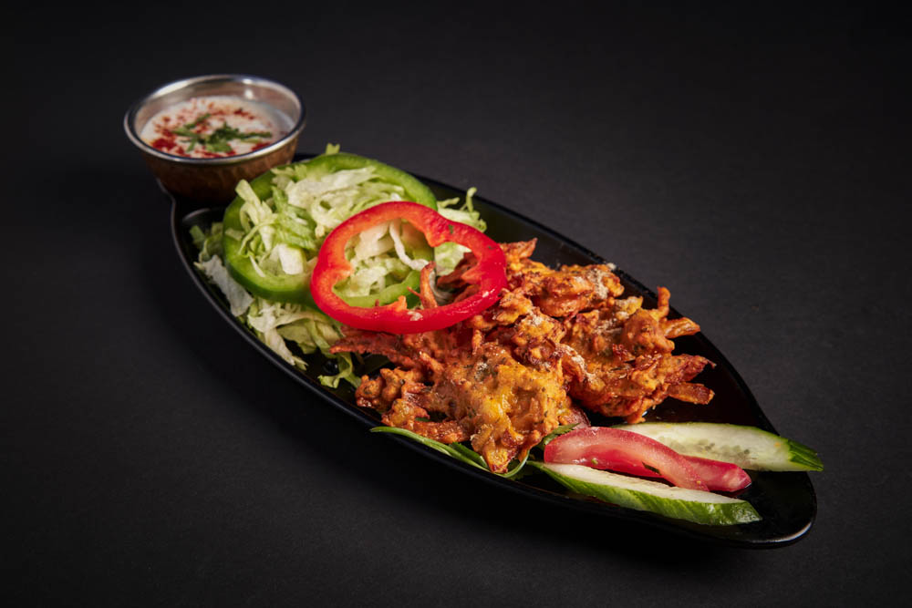 4. Payaz Pakora /79,-  Løk blandet med krydder og kikertmel, frityrstekt. Onions coated with chickpeas flour and fried. *Lactose