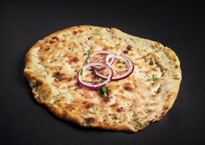 43.  Aloo Pyaz Nan /55,- Gjæret brød fylt med poteter, koriander og løk. Fermented bread filled with potatoes, coriander and onions. *Lactose, Eggs, Gluten