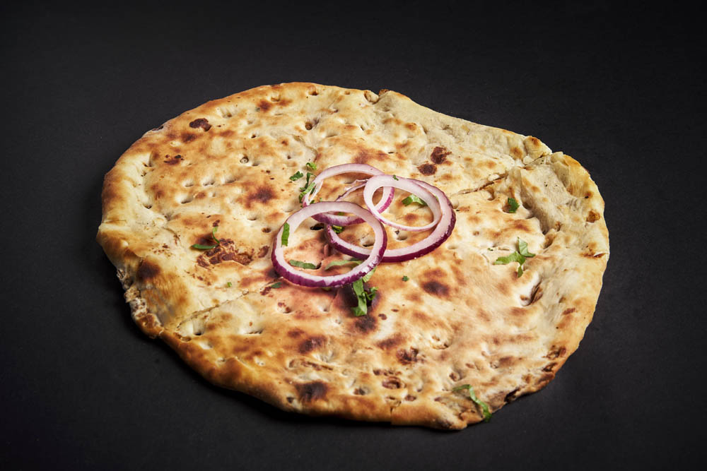 43.  Aloo Pyaz Nan /55,- Gjæret brød fylt med poteter, koriander og løk. Fermented bread filled with potatoes, coriander and onions. *Lactose, Eggs, Gluten