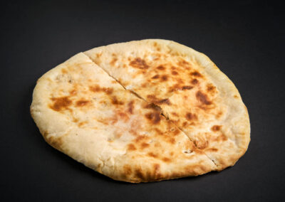 45.   Peshawari Nan /59,-  Gjæret brød fylt med kokos, sukker og mandler. Fermented bread filled with coconut, sugar and almonds. *Lactose, Eggs, Nuts, Gluten